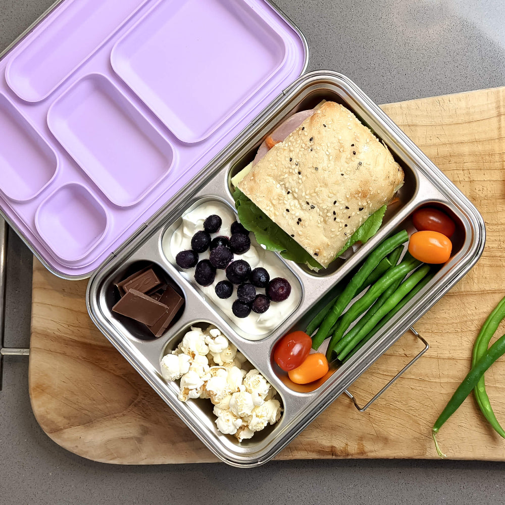 Ecococoon stainless steel leakproof bento box with five compartments and grape‑purple lid, shown filled with food to highlight its durable metal lunch box design.
