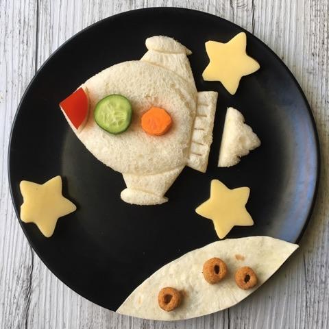 Space‑themed sandwiches made using the Lunch Punch Space cutters arranged in a kids lunchbox