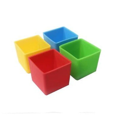 Munch Cups Square Bold set with four colourful silicone bento cups in red, yellow, green and blue.