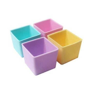 Bright square silicone bento cups from the Munch Cups Pastel set, perfect for organising snacks.