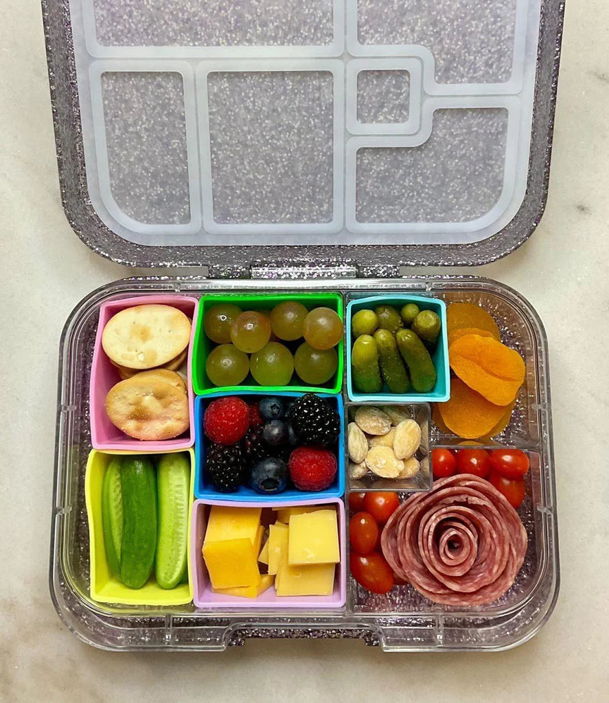 Mint rectangle silicone bento cups used as snack cups in a lunchbox to keep food organised.