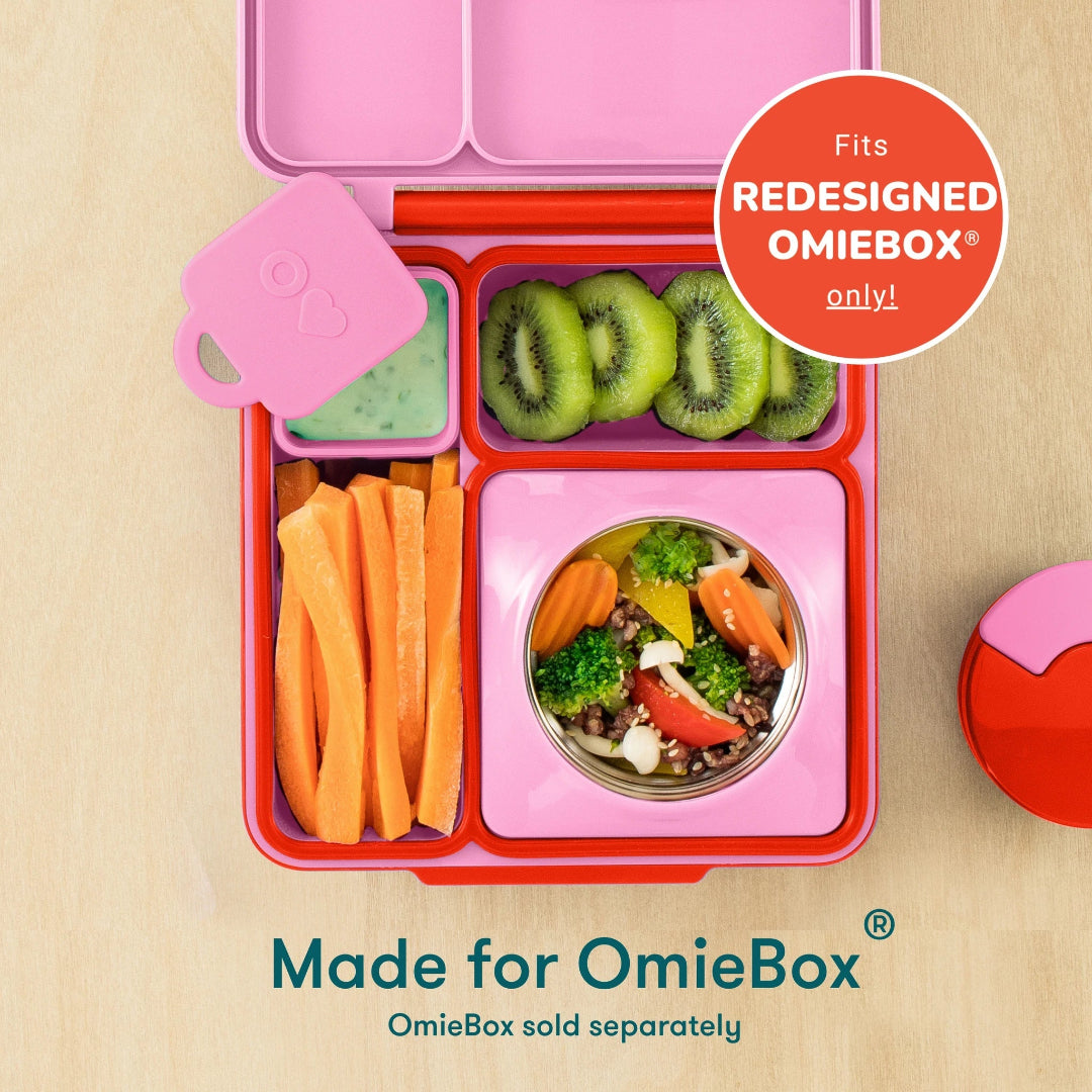 pink and purple omie dip containers placed inside omiebox v2 lunch box, baby bento