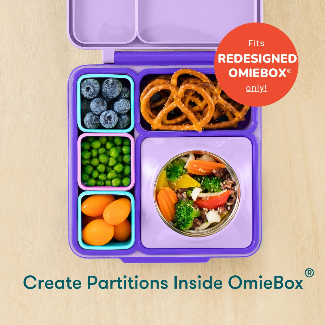 open omie dip containers in pink and purple filled with dip and carrots, baby bento
