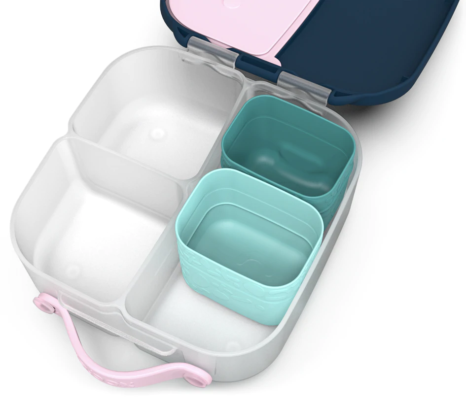Berry b.box silicone snack cups filled with food inside a kids’ lunchbox.
