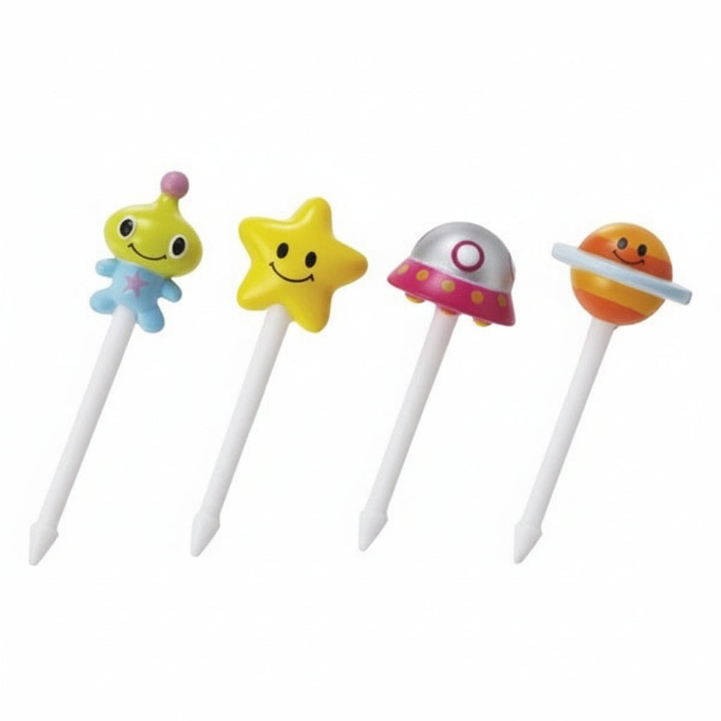 A set of four colorful space-themed food picks, including a green alien, a yellow star, a silver astronaut, and an orange planet design.